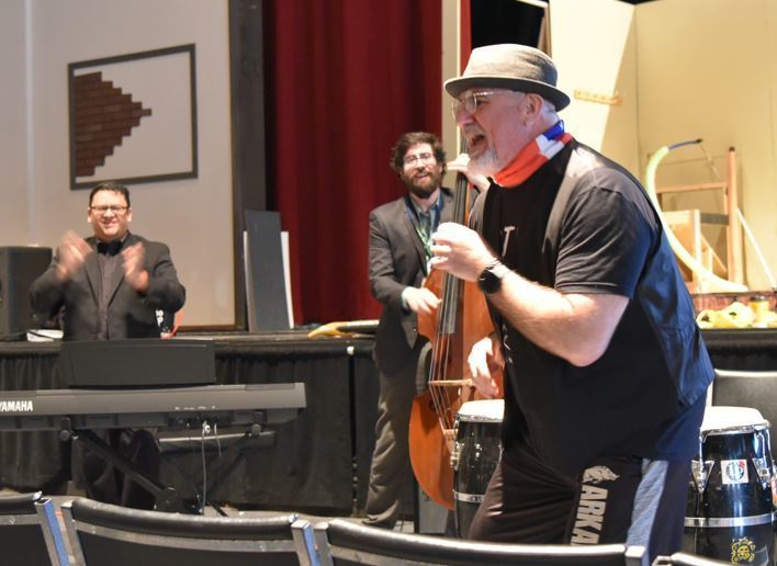 Al "Papa Rap" Lopez and Fernando Valencia perform with Garret Jones at AAA High School